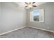 Cozy bedroom featuring window with shutters and neutral-toned carpet creating a comfortable space at 2215 E La Costa Dr, Gilbert, AZ 85298