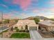 Charming single-story home with a desert landscape and mountain views in the background at 2215 E La Costa Dr, Gilbert, AZ 85298