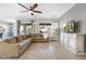 Bright living room featuring a comfortable sectional sofa, tile flooring, and natural light at 2215 E La Costa Dr, Gilbert, AZ 85298