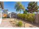 Backyard featuring a detached garage, desert landscaping and a stone walkway at 2219 N 13Th St, Phoenix, AZ 85006