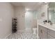 A modern bathroom with a glass-enclosed shower, stylish tile floor, and neutral palette at 2219 N 13Th St, Phoenix, AZ 85006