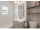 Bathroom with a tiled shower-tub combination and modern fixtures at 2219 N 13Th St, Phoenix, AZ 85006