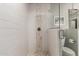 Modern bathroom highlighting a glass shower, white tile, and updated fixtures at 2219 N 13Th St, Phoenix, AZ 85006