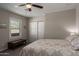 A cozy bedroom features a large window for natural light and sliding door closet at 2219 N 13Th St, Phoenix, AZ 85006