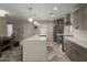 An open kitchen featuring stainless steel appliances, a long island, and stylish lighting at 2219 N 13Th St, Phoenix, AZ 85006