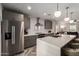 Stylish kitchen featuring stainless steel appliances, quartz countertops, and gray cabinetry at 2219 N 13Th St, Phoenix, AZ 85006