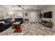 Inviting living room with herringbone floors, a cozy couch, and plenty of natural light at 2219 N 13Th St, Phoenix, AZ 85006