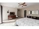 A serene main bedroom with a dresser, TV, and ensuite bathroom entrance at 2219 N 13Th St, Phoenix, AZ 85006