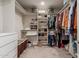 Spacious walk-in closet featuring built-in shelving and ample storage for clothes and shoes at 2219 N 13Th St, Phoenix, AZ 85006