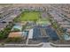 Aerial view of the community showcasing the green spaces, amenities, pools, and recreation areas for an active lifestyle at 22962 N 182Nd Ln, Surprise, AZ 85387