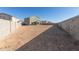 Large backyard with potential for a pool, garden, and outdoor living space, surrounded by privacy walls at 22962 N 182Nd Ln, Surprise, AZ 85387