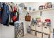 Organized walk-in closet with shelves, rods, and various items stored neatly at 22962 N 182Nd Ln, Surprise, AZ 85387