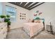 Bright bedroom featuring a light pink bed set and unique donut wall decor at 23193 E Nightingale Rd, Queen Creek, AZ 85142