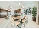 Dining area adjacent to the kitchen with modern lighting and decor at 23193 E Nightingale Rd, Queen Creek, AZ 85142