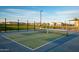 Outdoor pickleball court with blue and green surface, surrounded by a black fence at 23193 E Nightingale Rd, Queen Creek, AZ 85142