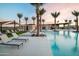 Community swimming pool with lounge chairs and shaded areas at 23193 E Nightingale Rd, Queen Creek, AZ 85142