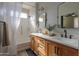 Modern bathroom with dual sinks, vanity, and a shower with glass door at 2393 E San Gabriel Trl, Casa Grande, AZ 85194