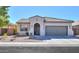 Charming single-story home with a well-maintained front yard and two-car garage, set against a clear blue sky at 2393 E San Gabriel Trl, Casa Grande, AZ 85194