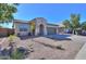 Attractive single-story house displaying low-maintenance desert landscaping and a spacious driveway leading to a two-car garage at 2393 E San Gabriel Trl, Casa Grande, AZ 85194