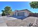 Appealing single-level residence with a neutral facade, tile roof, and drought-tolerant landscaping for easy maintenance at 2393 E San Gabriel Trl, Casa Grande, AZ 85194