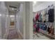 Hallway with a sliding barn door and a view to a walk-in closet at 2393 E San Gabriel Trl, Casa Grande, AZ 85194