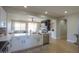 Kitchen island with sink and dishwasher overlooking the adjacent living area in an open floorplan home at 2393 E San Gabriel Trl, Casa Grande, AZ 85194