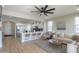 Bright living room with an open layout connected to kitchen and filled with modern furnishings at 2393 E San Gabriel Trl, Casa Grande, AZ 85194