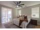 Bright main bedroom featuring a ceiling fan and access to a patio at 2393 E San Gabriel Trl, Casa Grande, AZ 85194