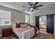 Comfortable main bedroom with a barn door to the ensuite bathroom at 2393 E San Gabriel Trl, Casa Grande, AZ 85194