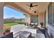 Inviting covered patio space with ceiling fans and outdoor seating, adjacent to the spacious backyard at 2393 E San Gabriel Trl, Casa Grande, AZ 85194