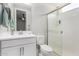 Modern bathroom featuring a glass-door shower, white toilet and towel rack at 25913 W Sands Dr, Buckeye, AZ 85396