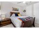 Comfortable bedroom featuring an updated ceiling fan and a window at 25913 W Sands Dr, Buckeye, AZ 85396