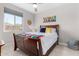 Bedroom with a large window and ceiling fan at 25913 W Sands Dr, Buckeye, AZ 85396