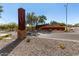 A landscaped entrance sign for Festival Foothills on a beautiful, sunny day at 25913 W Sands Dr, Buckeye, AZ 85396