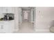 Hallway with tile flooring and neutral-toned walls at 25913 W Sands Dr, Buckeye, AZ 85396