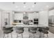 Modern kitchen featuring granite countertops, an island with seating, and stainless steel appliances at 25913 W Sands Dr, Buckeye, AZ 85396