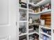 Walk-in pantry with lots of shelving for ample food storage at 25913 W Sands Dr, Buckeye, AZ 85396