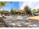 Community splash pad with shade structures, seating, and play area at 25913 W Sands Dr, Buckeye, AZ 85396