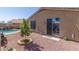 Cozy backyard with small tree planter, gravel, and access to the pool area at 2605 N 115Th Dr, Avondale, AZ 85392