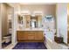 Bathroom featuring a double sink vanity, a soaking tub, and a neutral color scheme at 2605 N 115Th Dr, Avondale, AZ 85392