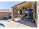 Inviting covered patio with ceiling fan and view of the backyard and pool at 2605 N 115Th Dr, Avondale, AZ 85392