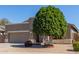 Charming single-story home featuring a well-manicured front yard and a two-car garage at 2605 N 115Th Dr, Avondale, AZ 85392