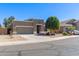 Single-story home featuring neutral stucco, a two-car garage and desert landscaping at 2605 N 115Th Dr, Avondale, AZ 85392