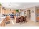 Well-lit kitchen with an island with seating, stainless steel appliances, and lots of natural light at 2605 N 115Th Dr, Avondale, AZ 85392