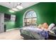 This bedroom features a large arched window overlooking the neighborhood at 2716 N Kristen --, Mesa, AZ 85213