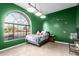 A bedroom with a large arched window provides natural light at 2716 N Kristen --, Mesa, AZ 85213