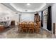 Formal dining room with a large wooden table and chairs, with built-in hutch at 2716 N Kristen --, Mesa, AZ 85213