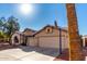 View of the house from the driveway including a basketball hoop at 2716 N Kristen --, Mesa, AZ 85213