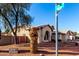 Corner lot house with well-maintained desert landscaping and a red privacy fence at 2716 N Kristen --, Mesa, AZ 85213