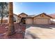 Charming single-story home with a three-car garage and desert landscaping at 2716 N Kristen --, Mesa, AZ 85213